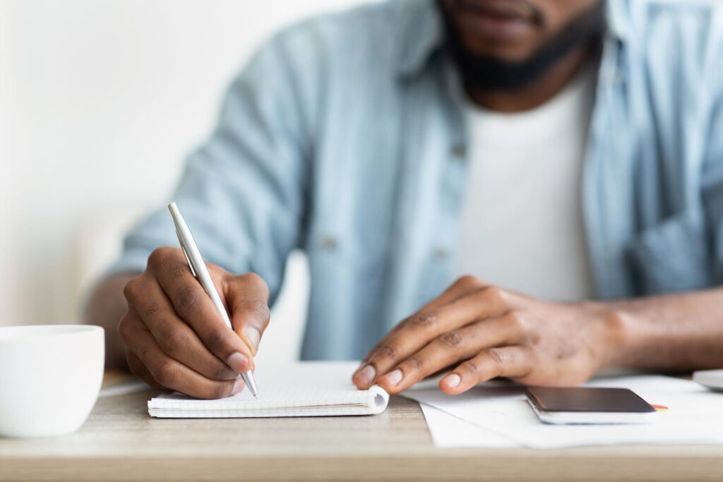 African American Businessman Writing Down His TM5Y3F7 1024x683