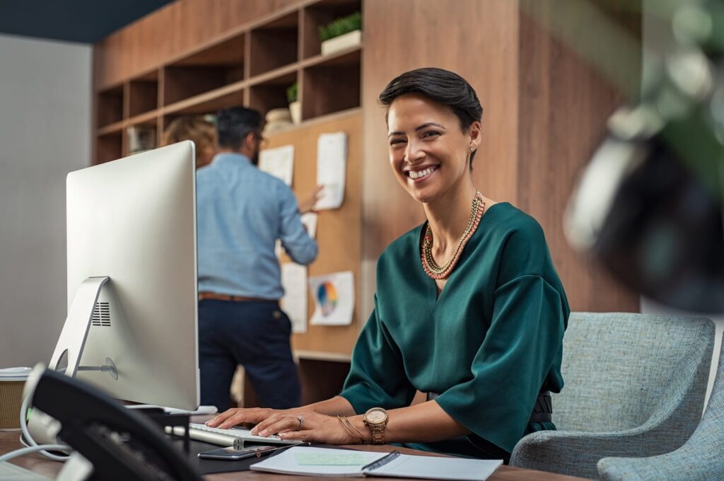 Young Businesswoman Smiling At Office LGQRJY2 1024x680