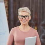 Mature Businesswoman Wearing Glasses YT5CU8Q 150x150