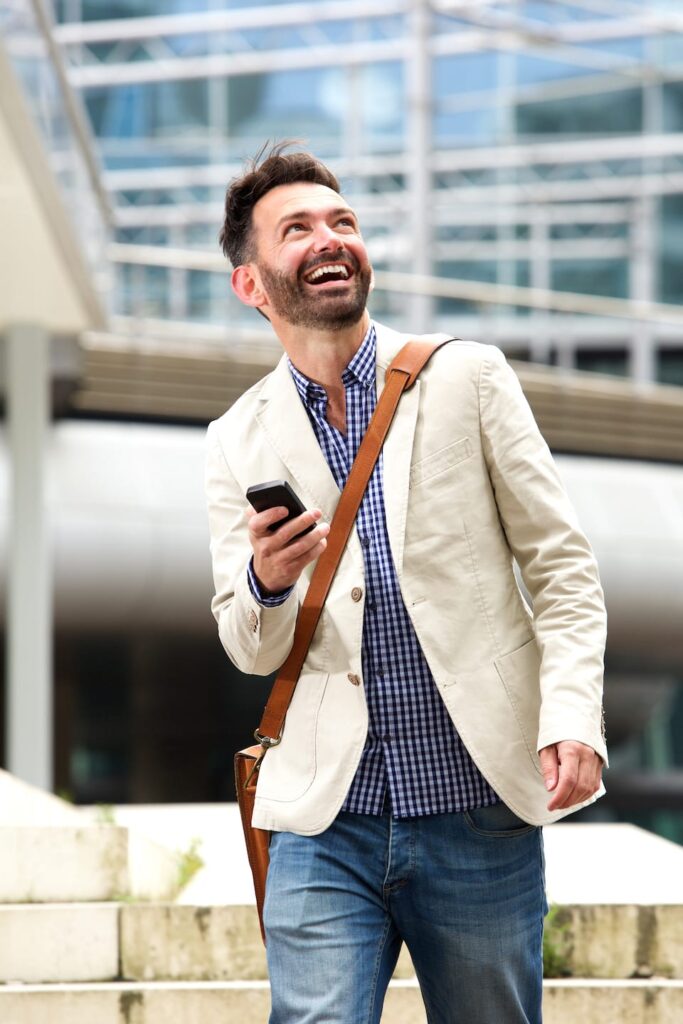 Smiling Mature Man Outdoors With Mobile Phone PB28ME5 683x1024
